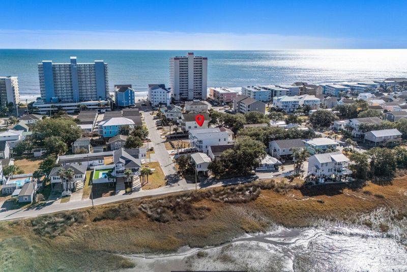 Aerial view of the house between the marsh and the ocean